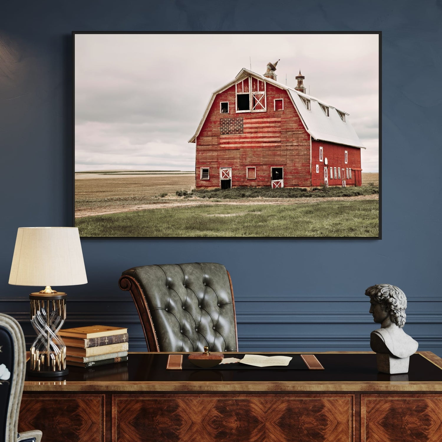 Old red barn with the American flag painted on it.  Shown as a large canvas print.